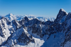 A view from Aiguille du Midi (3842m) on Grandes Jorasses (at the right side, 4208m), Grand Combin (at the left side, 4317m) and Monte Rosa (at the centre, in the distance, 4638m). Mount Cervino (4505m) is visible behind the Grand Combin